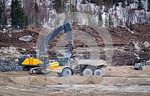 Excavator and a dumper working on a construction site
