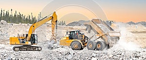 Excavator and dumpers working in a quarry