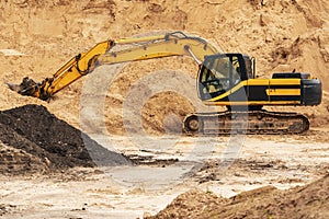Excavator during earthmoving at open pit