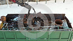 Excavator Grabs Scrap Metal With Grab For Recycling Remelting At A Landfill