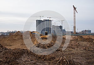 Excavator during groundwork on construction site. Hydraulic backhoe on earthworks