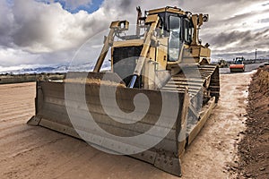 Excavator and heavy machinery in the construction of a highway