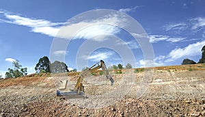 Excavator on a hill slope