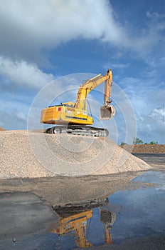 Excavator in a limestone photo