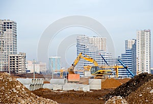 Excavator load the sand to the dump truck on construction site.