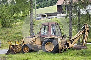 Excavator loader or backhoe machinery during earthmoving works at outdoor