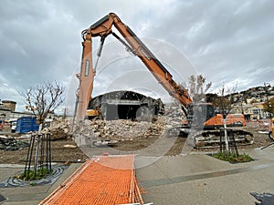 The excavator loader during the demolition of the Sala Tripcovich. Trieste