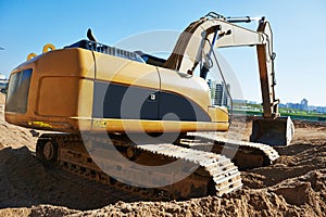 Excavator loader at earthmoving works