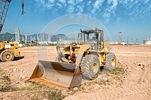 Excavator loader machine during earthmoving works outdoors