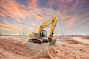 Excavator loader machine during earthmoving works outdoors photo