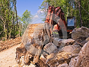 Excavator loader machine at road construction site
