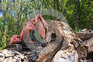 Excavator loader machine at road construction site.