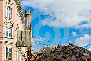 Excavator loader machine works outdoors at city, bottom view