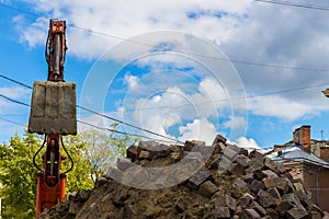 Excavator loader machine works outdoors at city, bottom view