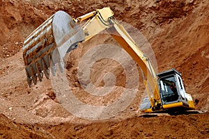 Excavator loader in sandpit photo