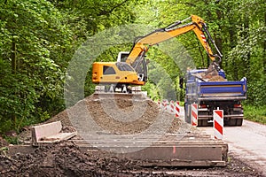 Excavator loading earth