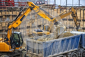 Heavy construction equipment working at the construction site