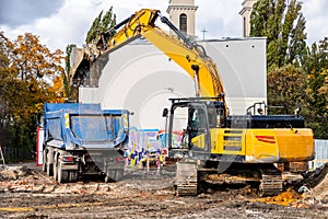 Excavator Loading Soil into Dump Truck