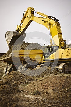 Excavator loading a truck.