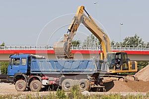 Excavator loading a truck