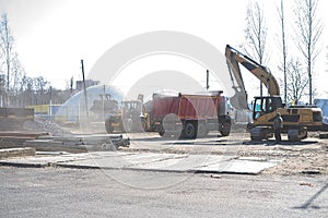 Excavator loads the excavation onto a truck are heavy construction equipment consisting