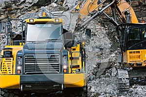 Excavator loads ore