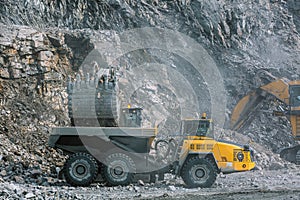 Excavator loads ore