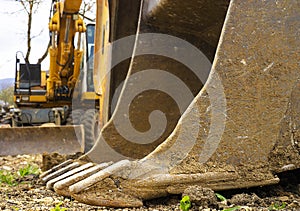 Excavator machine with a bucket in front