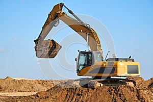 excavator at sandpit during earthmoving works photo