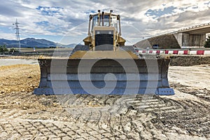 Excavator machine on road construction works, leveling the ground