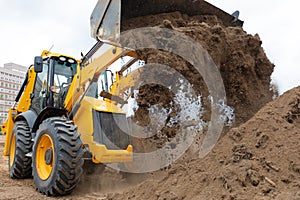 Excavator machine unloading soil