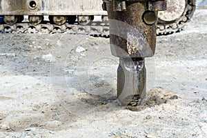 Excavator-mounted hydraulic jackhammer closeup