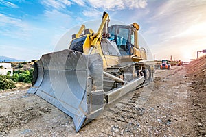 Excavator moving earth on construction works of a highway