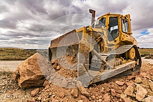 Excavator moving earth on construction works of a highway