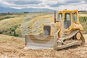 Excavator moving earth on a road construction works