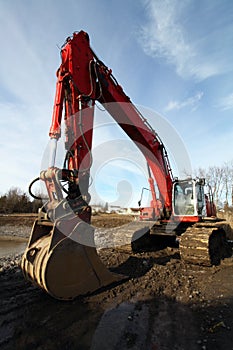 Excavator at muddy jobsite