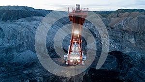 Excavator open pit coal mining night lights