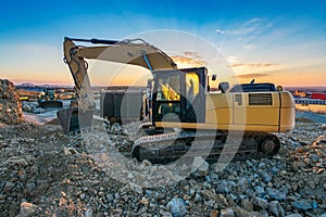 Excavator performing stone extraction work in an open pit stone mine