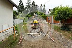 Excavator ploughshare on trench - constructing canalization