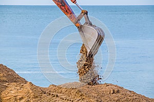 Excavator on the reclamation