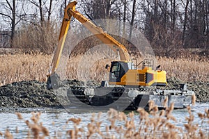 Excavator on the river