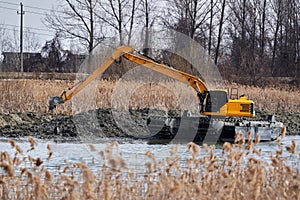 Excavator on the river