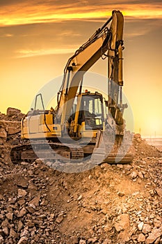 Excavator on the road construction works. Machinery needed for construction