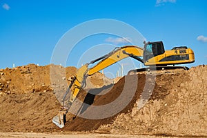 excavator at sandpit during earthmoving works