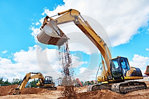 Excavator at sandpit during earthmoving works