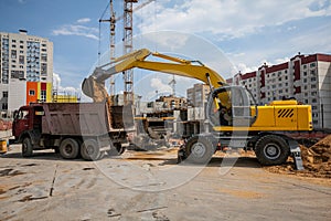 Excavator at sandpit during earthmoving works