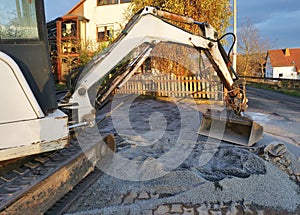Excavator shovel distributes paving stones