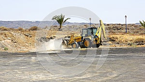 Excavator smoothing the ground in Arrieta, Lanzarote photo