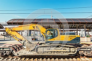 Excavator stands on the railway transporter