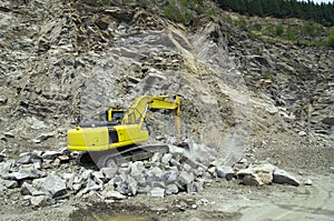 Excavator in stone quarry